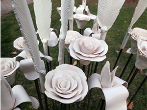 COMPASS told the story of the three main groups of people here at the time of Confederation, Canada today and Canada projected into the future. The feathers, roses and fleurs de lys are sculptures that were part of a special project for Canada's sesquicentennial in 2017 called Populace, where 9000 of these exact pieces were installed at the Canadian Museum of Nature.